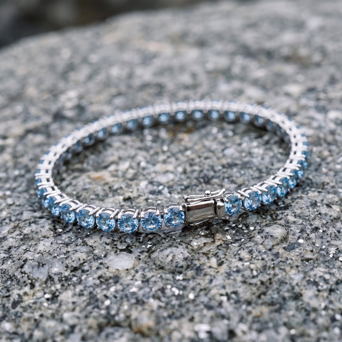Aqua Capri bracelet resting on speckled granite