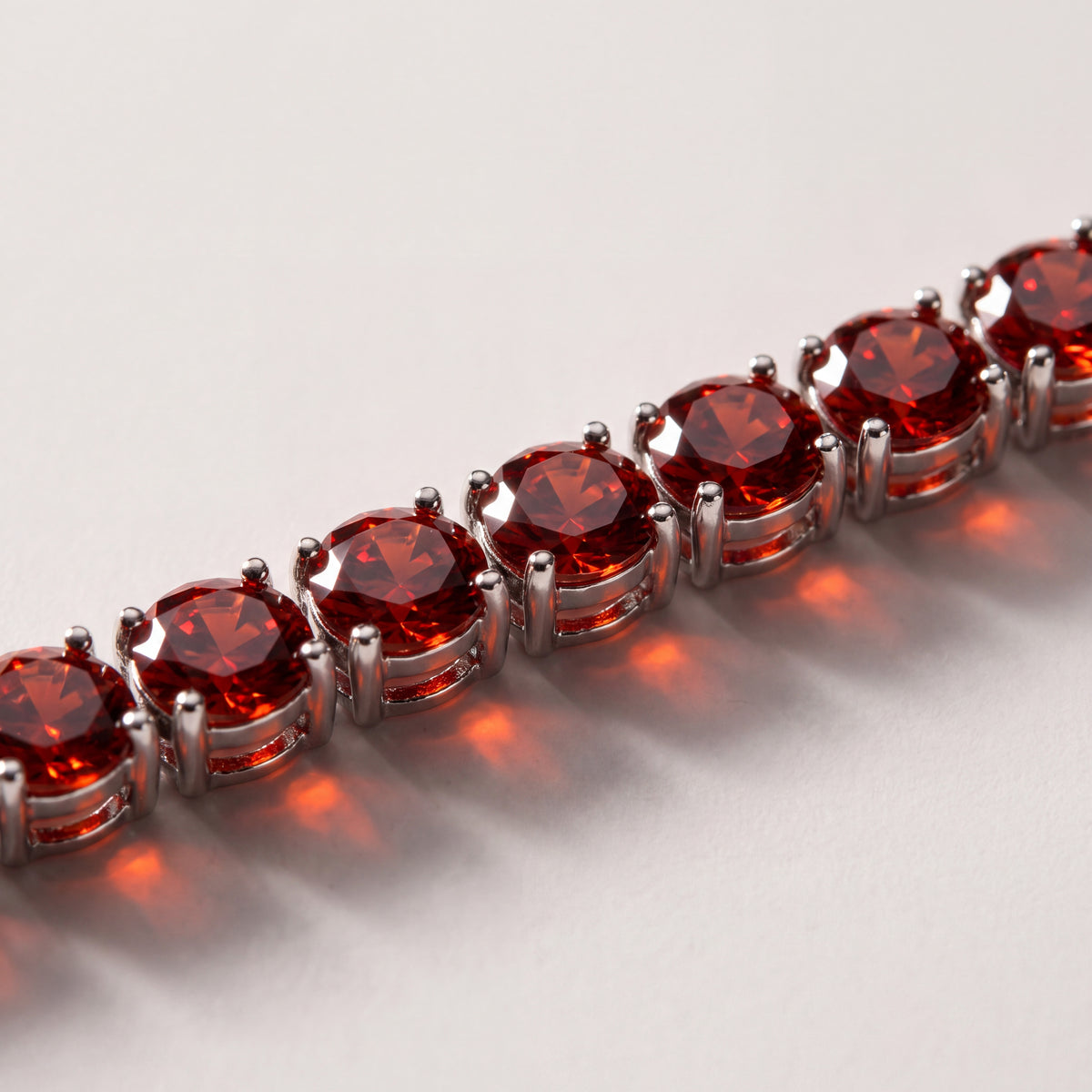 Macro detail of the Rubi Garnet bracelet's 4mm stones