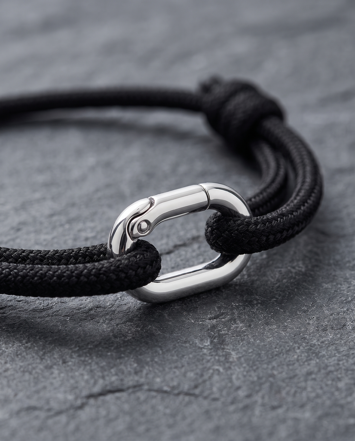 Close-up of the Verona Silver black Italian Supima cord bracelet with polished 925 sterling silver oval link