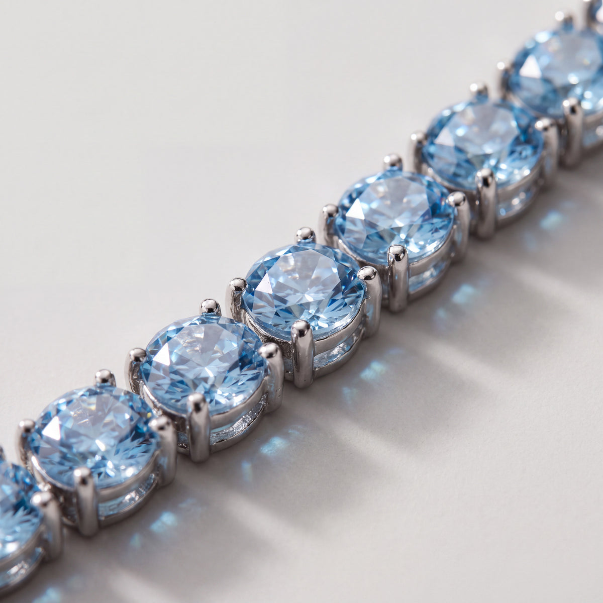 Macro detail of the Aqua Capri bracelet's 4mm stones