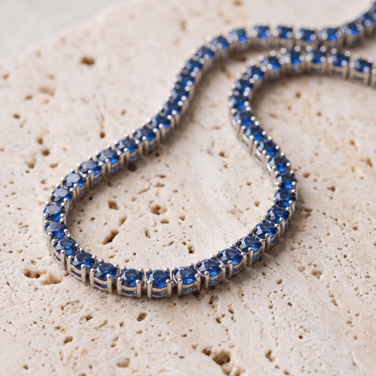 Bleu Chain laid on travertine