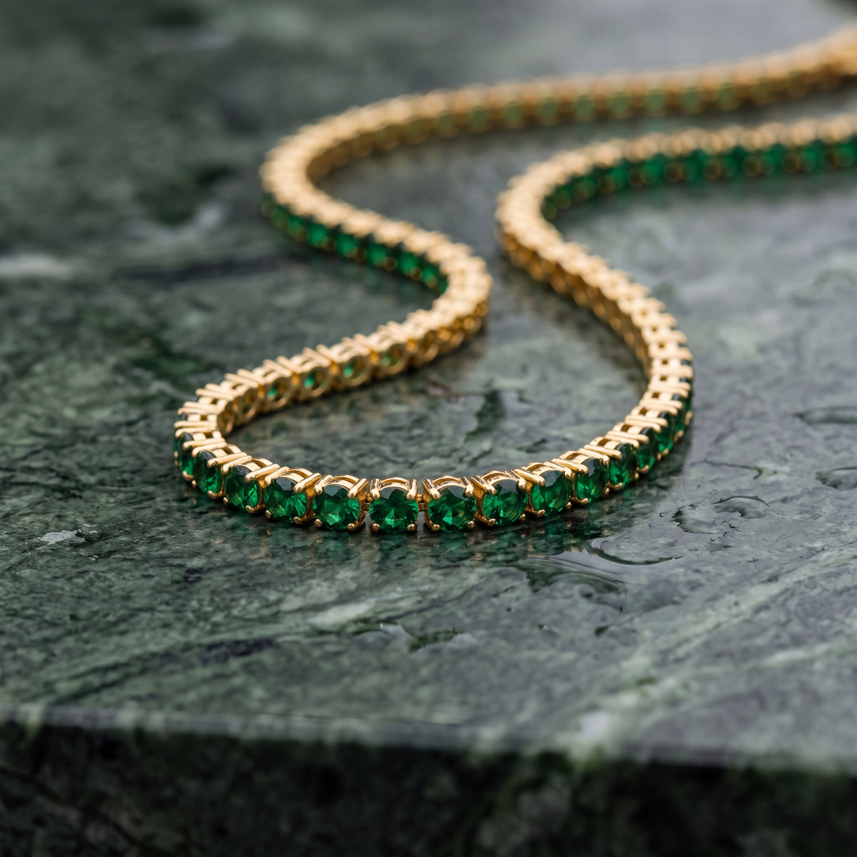 Green Day Dore Chain laid on green serpentine stone