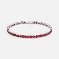Rubi Garnet tennis bracelet, deep red stones in silver settings, on a light grey background