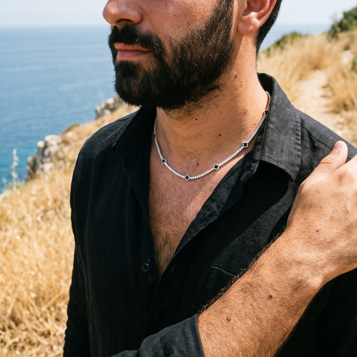 Noir Clover Necklace worn - on the hand